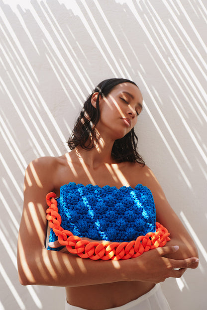 BLUE BUBBLE BAG WITH ORANGE CHAIN